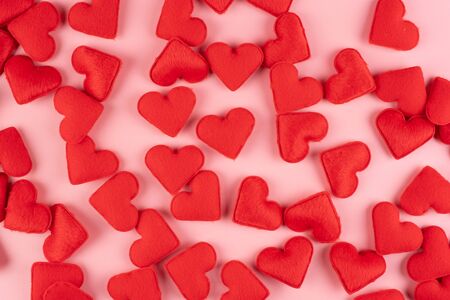 Red heart shape decoration on pink background. Love, Wedding, Romantic and Happy Valentine day holiday conceptの写真素材