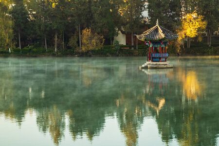 Beautiful of Black Dragon Pool with Jade Dragon Snow Mountain background, landmark and popular spot for tourists attractions near Lijiang Old Town. Lijiang, Yunnan, Chinaのeditorial素材