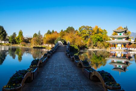 Beautiful of Black Dragon Pool with Jade Dragon Snow Mountain background, landmark and popular spot for tourists attractions near Lijiang Old Town. Lijiang, Yunnan, Chinaのeditorial素材