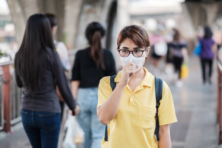 young Asian woman wearing protection mask.の写真素材