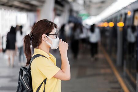 young Asian woman wearing protection mask.の写真素材