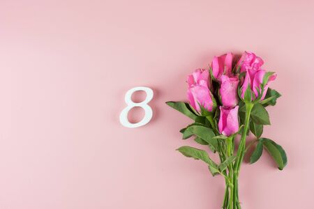 Pink Rose flower and 8th Number on pink background with copy space for text. Love, Equal and International Women day conceptの写真素材