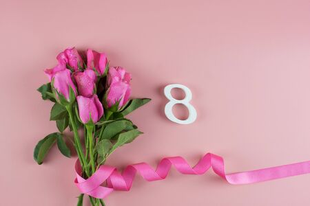Pink Rose flower and 8th Number on pink background with copy space for text. Love, Equal and International Women day conceptの写真素材
