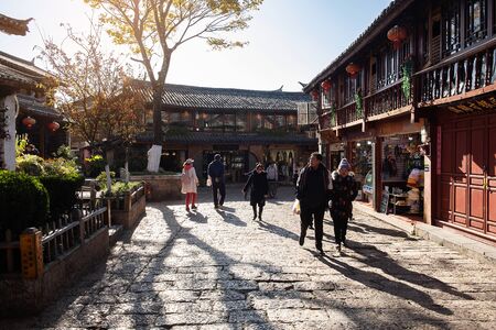 Shops along the Square Street and people at Lijiang Old Town. landmark and popular spot for tourists attractions. Lijiang, Yunnan, China, 7 December 2019のeditorial素材
