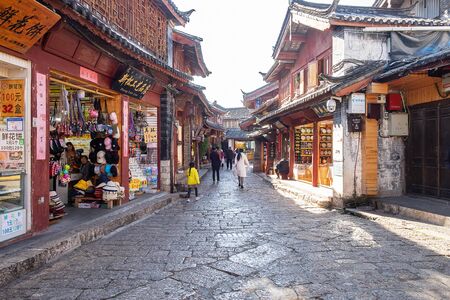 Shops along the Square Street and people at Lijiang Old Town. landmark and popular spot for tourists attractions. Lijiang, Yunnan, China, 7 December 2019のeditorial素材