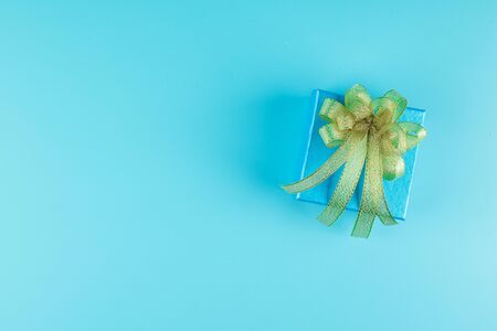 Top view gift box on blue background with copy space for text, preparation for fathers. World International men day, Father's day, Birthday and happy new year conceptの写真素材