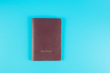 Top view passport on blue background with copy space for textの写真素材