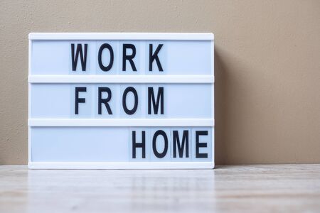 lightbox with text WORK FROM HOME on table. Coronavirus, Covid-19, Quarantines and Social Distancing conceptの写真素材