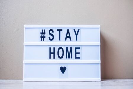 lightbox with text #STAY HOME on table. Coronavirus, Covid-19, Quarantines and Social Distancing conceptの写真素材