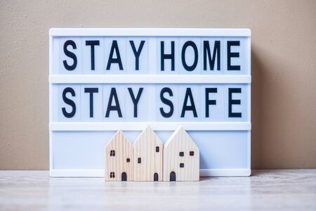 lightbox with text STAY HOME STAY SAFE on table. Coronavirus, Covid-19, Quarantines and Social Distancing conceptの写真素材