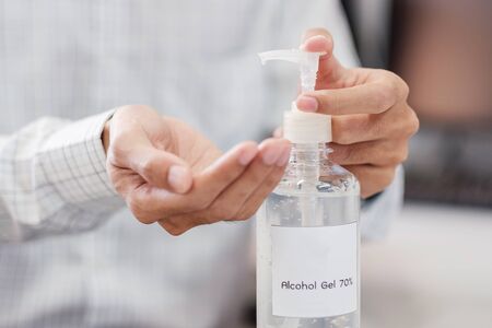 Man hands using wash hand alcohol gel or sanitizer bottle dispenser, against Novel coronavirus or Corona Virus Disease (Covid-19) . Antiseptic, Hygiene and Health conceptの写真素材