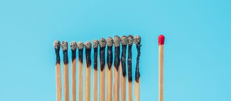 burnt out match sticks and gap distance showing preventative containing coronavirus pandemic with copy space for text. Stay at home, Quarantines and Social Distancing conceptの写真素材