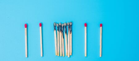 burnt out match sticks and gap distance showing preventative containing coronavirus pandemic with copy space for text. Stay at home, Quarantines and Social Distancing conceptの写真素材