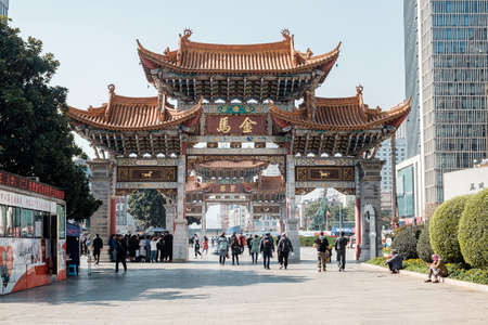 Jinbi square, golden Horse and Jade Rooster Archways. landmark and popular for tourists attractions in Kunming. Kunming, Yunnan, China. 10 December 2019のeditorial素材