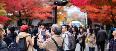 Tourists enjoying with colorful leaves in the garden, traveler visit Eikando temple in Autumn season, landmark and famous for tourist attractions in Kyoto. Kyoto, Kansai, Japan, 25 November 2019のeditorial素材