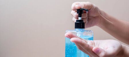 Man hands using wash hand alcohol gel or sanitizer bottle dispenser, against Novel coronavirus or Corona Virus Disease (Covid-19) . Antiseptic, Hygiene and Health conceptの写真素材