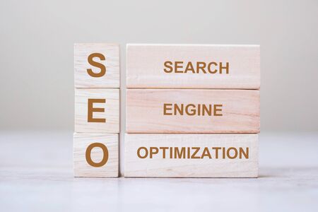 SEO (Search Engine Optimization) text wooden cube blocks on table background. Idea, Vision, Strategy, Analysis, Keyword and Content conceptの写真素材