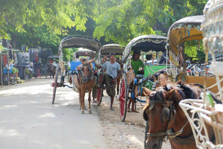 Horse carriage for tourists traveling in Ava (Inwa) near Mandalay in Myanmar (Burma). Landmark and...