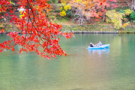 colorful leaves mountains and Katsura river in Arashiyama, landscape landmark and popular for tourists attractions in Kyoto, Japan. Fall Autumn season, Vacation,holiday and Sightseeing conceptの写真素材