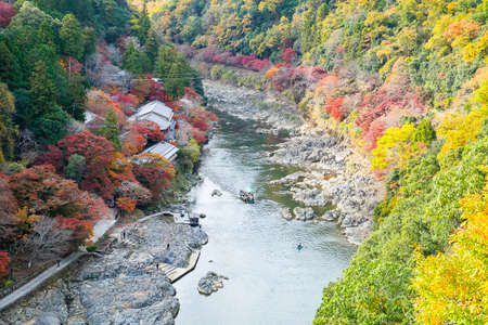 colorful leaves mountains and Katsura river in Arashiyama, landscape landmark and popular for tourists attractions in Kyoto, Japan. Fall Autumn season, Vacation,holiday and Sightseeing conceptの写真素材