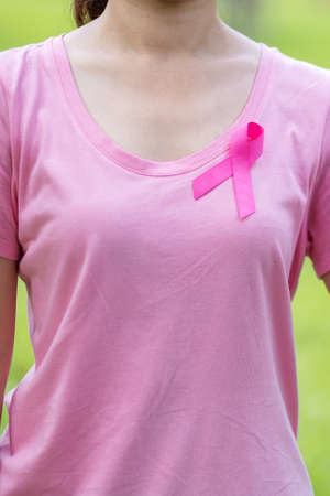October Breast Cancer Awareness month, adult Woman in pink T- shirt and Pink Ribbon for supporting people living and illness. International Women, Mother and World cancer day conceptの写真素材