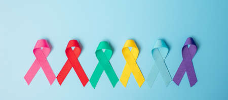 World cancer day (February 4). colorful awareness ribbons; blue, red, teal, pink, purple and yellow...
