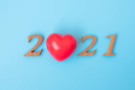 2021 number with red heart shape  on blue background, health, Insurance and New Year New You conceptの写真素材