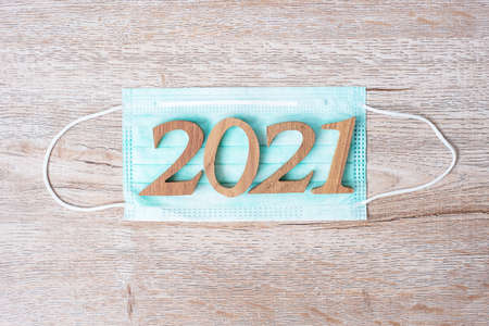 2021 New Year with medical face mask, prevent coronavirus or Corona Virus Disease (Covid-19)....
