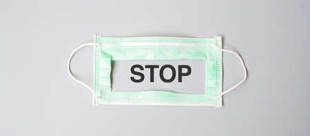 medical face mask on grey background, prevent coronavirus or Corona Virus Disease (Covid-19)....