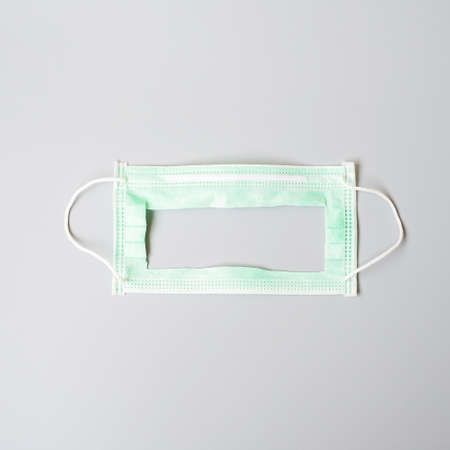 medical face mask on grey background, prevent coronavirus or Corona Virus Disease (Covid-19)....