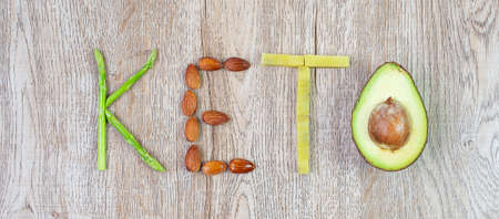 KETO arrangement of Organic Asparagus, Almond, and Avocado on table background. weight loss, ,Healthy food, Ketogenic diet, low carb and vegetarian conceptの写真素材