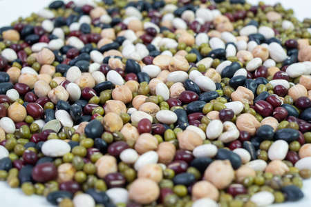 Organic mixed Beans; Green, Black, Red, White and Chick pea on plateの写真素材