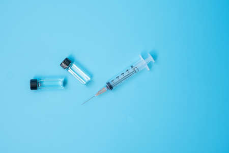 Vaccine vial dose with shot drug needle syringe in hospital laboratory. Medical, health, Vaccination and immunization conceptの写真素材