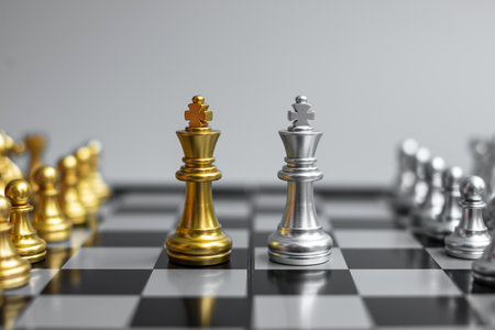 Gold Chess King figure and Checkmate enermy or opponent during chessboard competition. Strategy,...