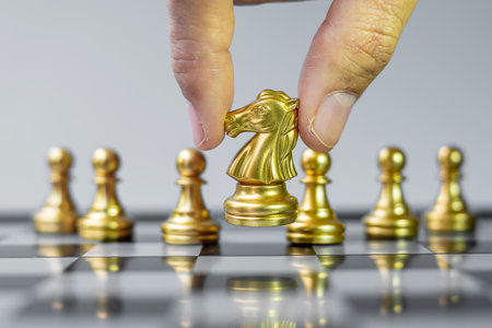 Gold Chess Knight figure Stand out from the crowd on Chessboard background. Strategy, leadership, business, teamwork, different, Unique and Human resource management conceptの写真素材