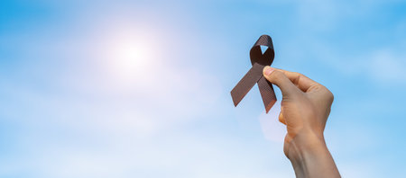 Melanoma and skin cancer, Vaccine injury awareness month and rest in peace concepts. man holding...