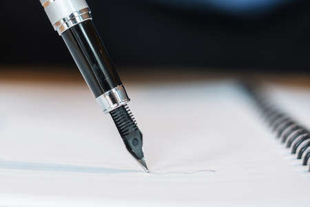 pen with signature on paper report. business conceptsの写真素材