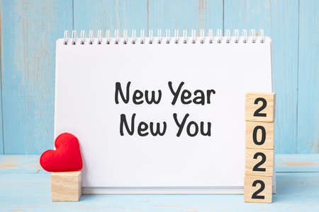 New Year New You words and 2022 cubes with red heart shape decoration on blue wooden table background. Goal, Resolution, health, Love and Happy Valentineâs day conceptの写真素材
