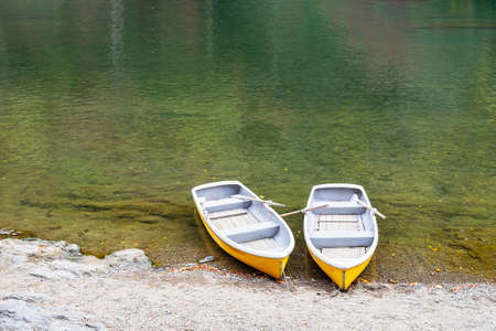 couple yellow boats in Katsura river at Arashiyama, landmark and popular for tourists attractions in Kyoto, Japan.の写真素材