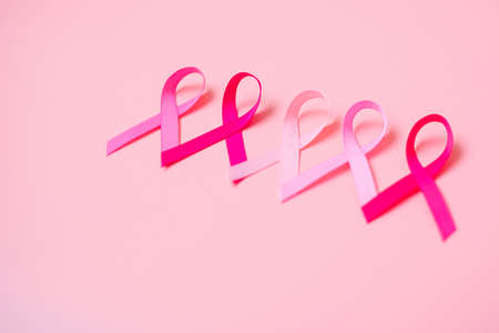 October Breast Cancer Awareness month, Pink Ribbon on pink background for supporting people living and illness. International Women, Mother and World cancer day conceptの写真素材