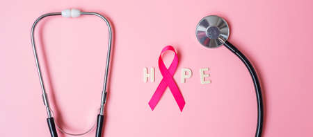 Breast Cancer Awareness, Pink Ribbon with Stethoscope on pink background for supporting people living and illness. Woman Healthcare and World cancer day conceptの写真素材