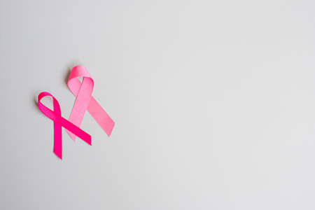 October Breast Cancer Awareness month, Pink Ribbon on grey background for supporting people living and illness. International Women, Mother and World cancer day conceptの写真素材