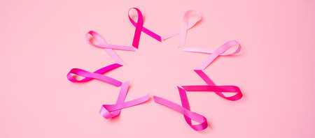 October Breast Cancer Awareness month, Pink Ribbon on pink background for supporting people living and illness. International Women, Mother and World cancer day conceptの写真素材