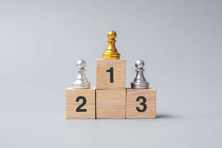 top of golden chess pawn pieces or leader businessman. victory, leadership, business success, team, recruiting, and teamwork conceptの写真素材