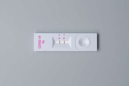 Rapid Antigen Test kit with Positive result during swab COVID-19 testing. Coronavirus Self nasal or...