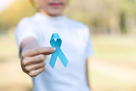 November Prostate Cancer Awareness month, woman holding Blue Ribbon for supporting people living and illness. Healthcare, International men, Father, World cancer day and world diabetes day conceptの写真素材
