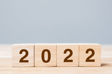 2022 wooden cube blocks on table background. Resolution, plan, review, goal, start and New Year holiday conceptsの写真素材