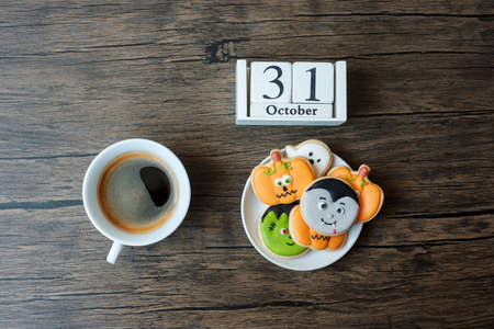 Happy Halloween day with cookies, coffee and 31 October calendar on white background. Trick or Threat, Hello October, fall autumn, Festive, party and holiday conceptの写真素材