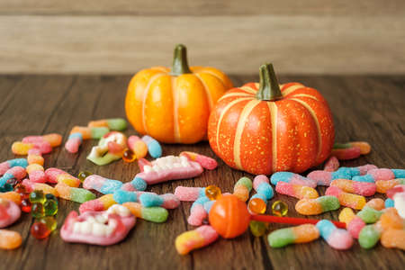 Happy Halloween day with ghost candies, pumpkin, Jack O lantern and decorative (selective focus). Trick or Threat, Hello October, fall autumn, Festive, party and holiday conceptの写真素材
