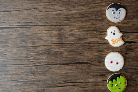 Happy Halloween day with funny Cookies set on wooden table background. Trick or Threat, Hello October, fall autumn, Festive, party and holiday conceptの写真素材
